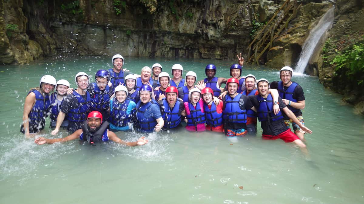 A mission team in helmets and life jackets at the 27 Waterfalls in the Dominican Republic