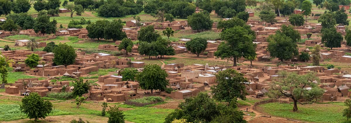 Villages and trees spread across the plains of Burkina Faso