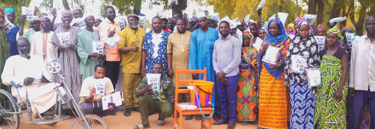 A large group of church leaders and families gathers outdoors in Cameroon