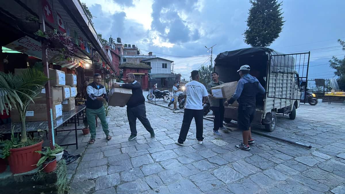 A truck of filter boxes arrives on a street in Nepal