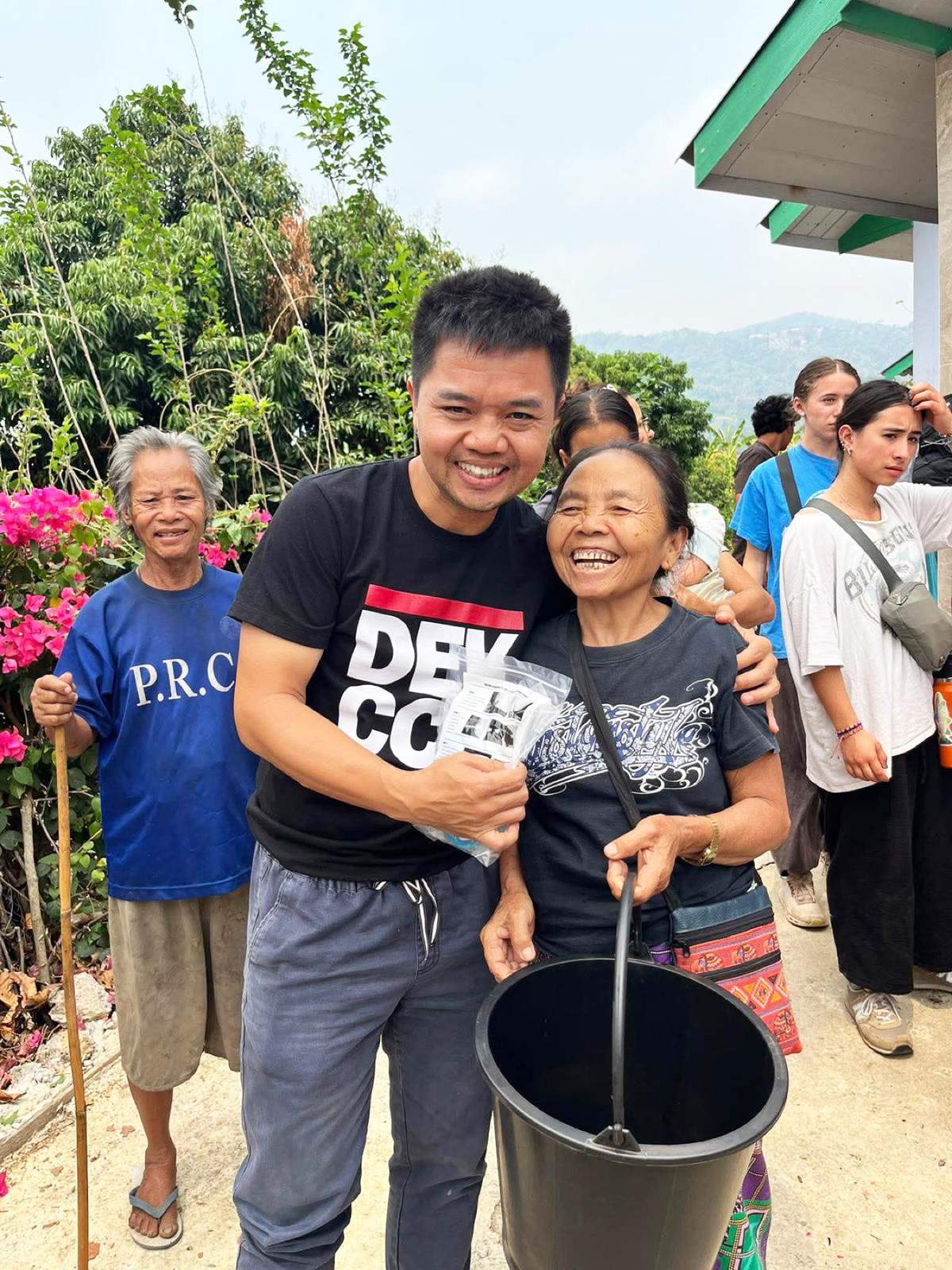 A ministry partner embraces an older woman in her community