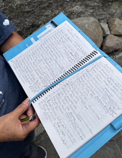 Pastor Veronica’s notebook has complete notes on each family the mission team visits in the community.