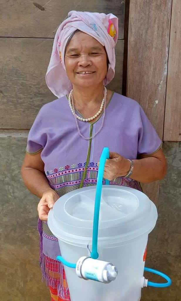 Purple shirt woman with bucket